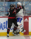 Ottawa Senators center Shane Pinto (57) collides with Montreal Canadiens defenseman Jayden Struble (47) during second-period NHL hockey game action in Ottawa, Ontario, Saturday, April 13, 2024. (Adrian Wyld/The Canadian Press via AP)