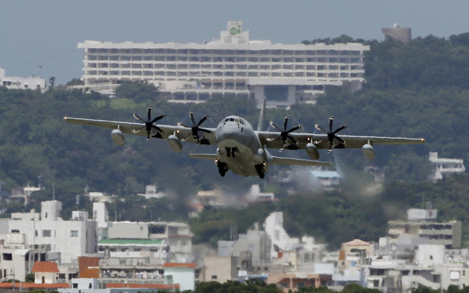 FILE - This Aug. 16, 2012 file photo shows a C-130 transport plane taking off from the U.S. Marine Corps base in Futenma in Okinawa, Japan. An Associated Press investigation into the military’s handling of sexual assaults in Japan has found a pattern of random and inconsistent judgments in which most offenders are not incarcerated. Instead, commanders have ordered “nonjudicial punishments” that ranged from docked pay to a letter of reprimand. (AP Photo/Greg Baker, File)