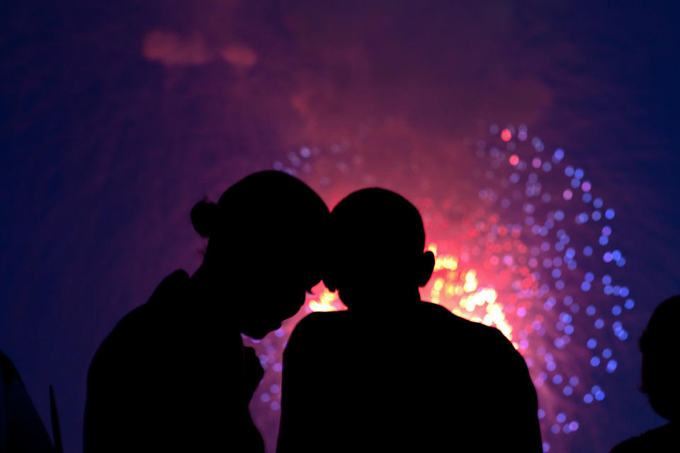 President Barack Obama and first lady&nbsp;Michelle Obama watch the fireworks over the National Mall from the roof of the White House on July 4, 2010.