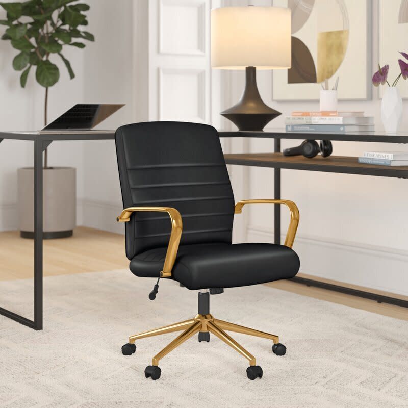 Readers flocked to this faux leather desk chair with gold armrests and "lumbar-friendly" backrest, which was another <a href="https://www.huffpost.com/entry/prime-day-deals-huffpost-editor-recommendations-2020_l_5f7c86d1c5b61229a057c5a5" target="_blank" rel="noopener noreferrer">pick from one of our editors</a>. It'll definitely help inspire a few bright ideas. <a href="https://fave.co/37PpB9p" target="_blank" rel="noopener noreferrer">Find it for $187 at Wayfair</a>.