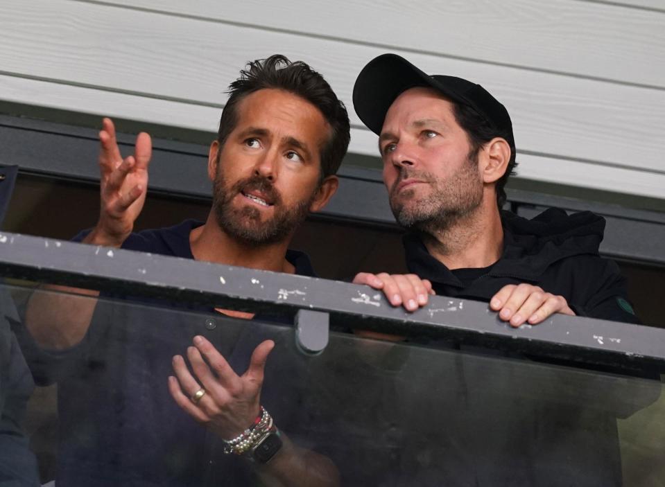Wrexham co-owner Ryan Reynolds (left) and Paul Rudd in the stands during the Vanarama National League match at The Racecourse Ground, Wrexham. Picture date: Saturday April 22, 2023.