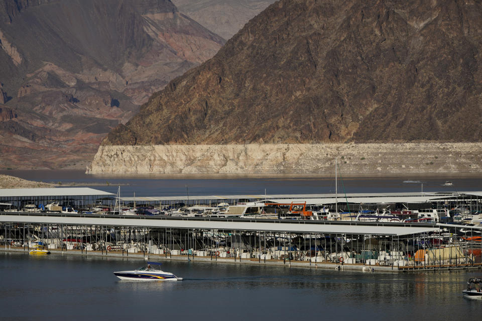 A bathtub ring of light minerals delineates the high water mark on Lake Mead at the Lake Mead National Recreation Area, Thursday, Aug. 13, 2020, near Boulder City, Nev. The U.S. Bureau of Reclamation is expected to release projections that suggest the levels in Lake Powell and Lake Mead dipped slightly compared with last year. (AP Photo/John Locher)