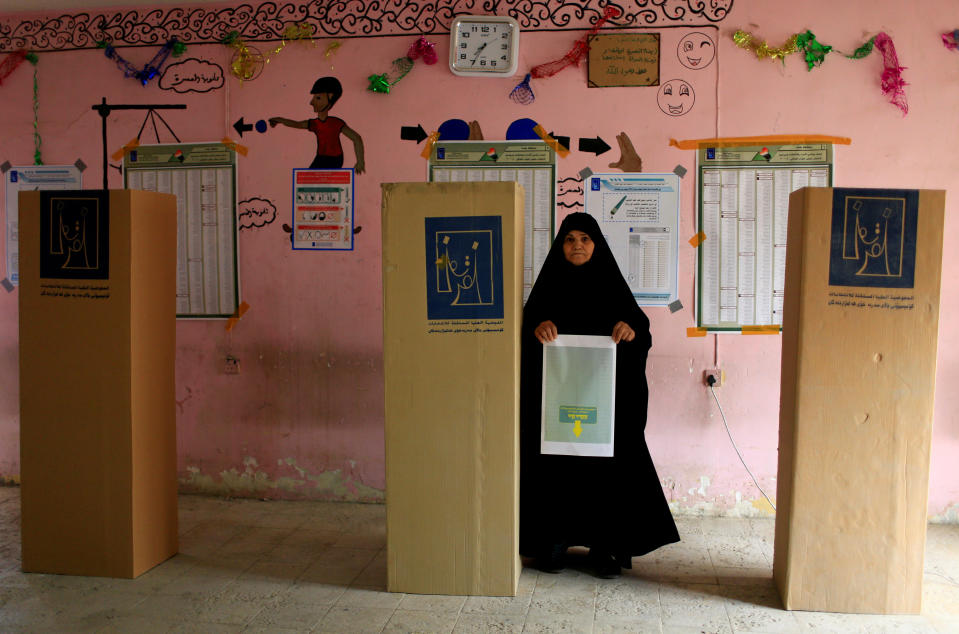 <p>An Iraqi woman arrives to cast her vote at a polling station during the parliamentary election in the Sadr city district of Baghdad, Iraq, May 12, 2018. (Photo: Thaier al-Sudani/Reuters) </p>