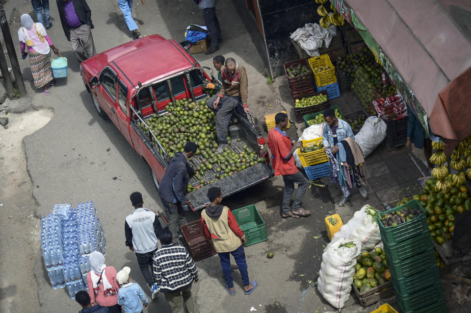 A pickup truck delivers avocados to a vegetable shop in Addis Ababa, Ethiopia Thursday, Nov. 3, 2022. Ethiopia's warring sides agreed Wednesday to a permanent cessation of hostilities in a conflict believed to have killed hundreds of thousands, but enormous challenges lie ahead, including getting all parties to lay down arms or withdraw. (AP Photo)
