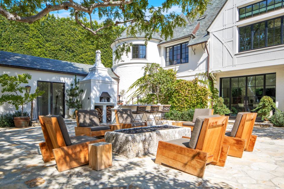 In the back of the home, a turret gives the place a Tudor-style vibe.