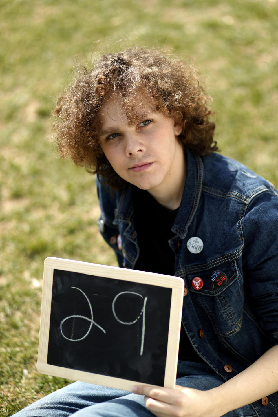 Alix West, 17, of Reisterstown, Md., poses for a portrait with a chalkboard of her age in 2030, the point where the globe would be stuck on a path toward what scientists call planet-changing dangerous warming, Friday, March 15, 2019, during a climate change rally of students in Washington. "I don't want to die," says West, "I want to live in a clean world where I can have a kid that can survive." From the South Pacific to the edge of the Arctic Circle, students are skipping classes to protest what they see as the failures of their governments to take tough action against global warming. The 'school strikes' on Friday were inspired by 16-year-old Swedish activist Greta Thunberg and are taking place in over 100 countries. (AP Photo/Jacquelyn Martin)