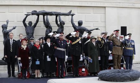 Britain's Prince Harry (C) attends Armistice Day commemorations at the National Memorial Arboretum in Alrewas, Britain, November 11, 2016. REUTERS/Darren Staples