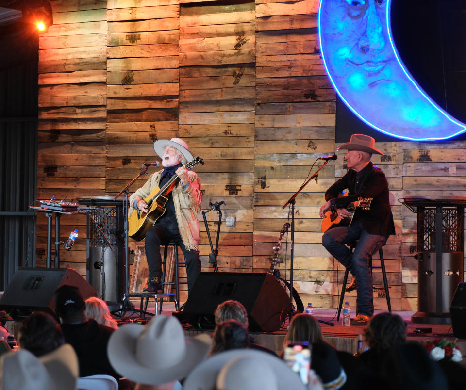 Michael Martin Murphey sings his iconic song "Wildfire" with Lyle Lovett looking on Sunday evening at the Rangeland Fire Relief Benefit Concert at the Starlight Ranch in Amarillo.