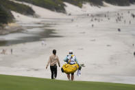 Lydia Ko, of New Zealand, walks on the ninth fairway with her caddie during the first round of the U.S. Women's Open golf tournament at the Pebble Beach Golf Links, Thursday, July 6, 2023, in Pebble Beach, Calif. (AP Photo/Darron Cummings)