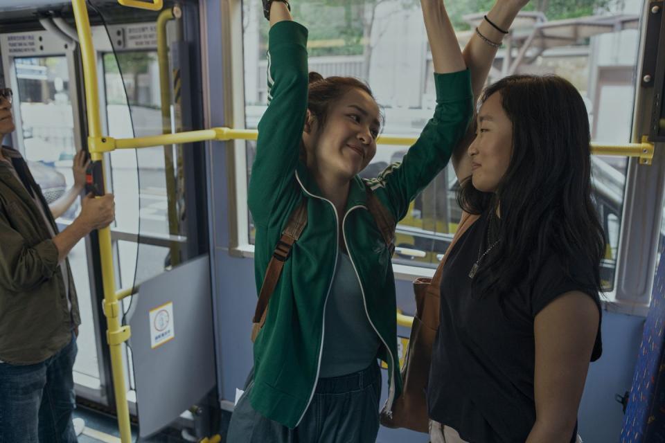 a person holding a green scarf