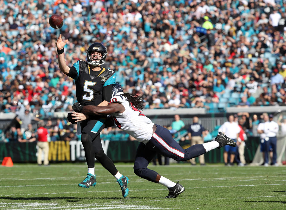 Jadaveon Clowney hits Blake Bortles during the Jacksonville Jaguars’ 45-7 win over the Houston Texans. (Getty Images)