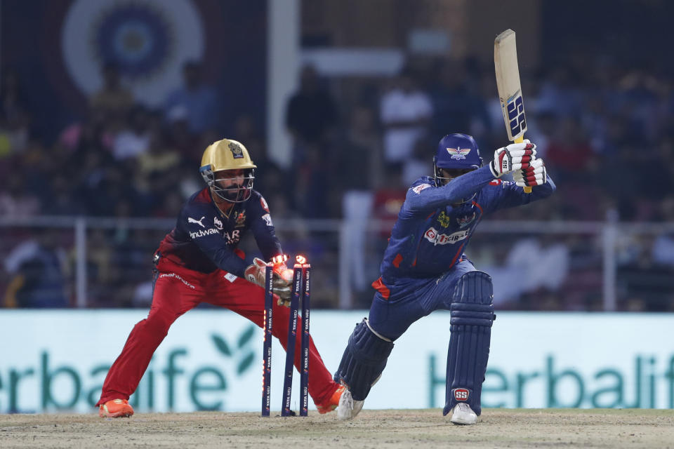 Royal Challengers Bangalore's Dinesh Karthik stumps Lucknow Super Giants' Deepak Hooda during the Indian Premier League (IPL) match between Lucknow Super Giants and Royal Challenger Bangalore in Lucknow, India, Monday, May 1, 2023. (AP Photo/Surjeet Yadav)