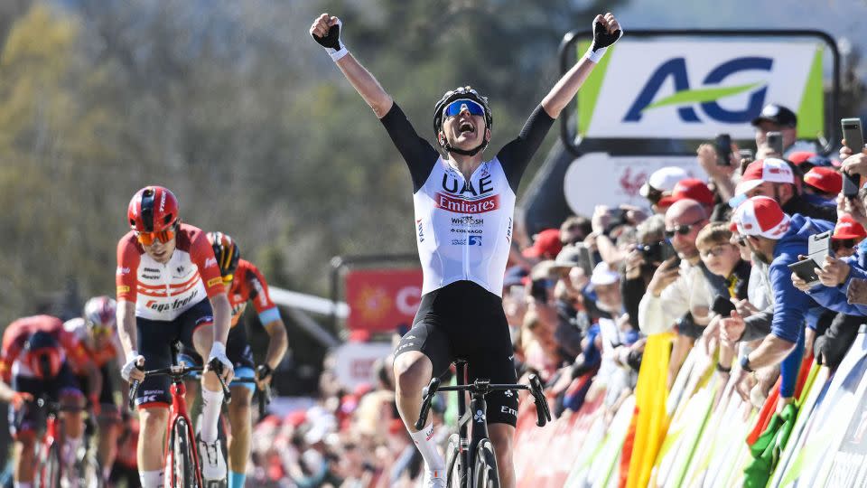 Pogačar celebrates as he crosses the finish line to win the 86th edition of 'La Flèche Wallonne' men's race on April 19, 2023. - Goyvaerts/AFP/BELGA/Getty Images