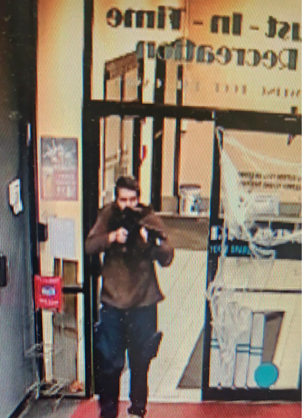 The shooter entering Sparetime Recreation in Lewiston, Maine (AP)