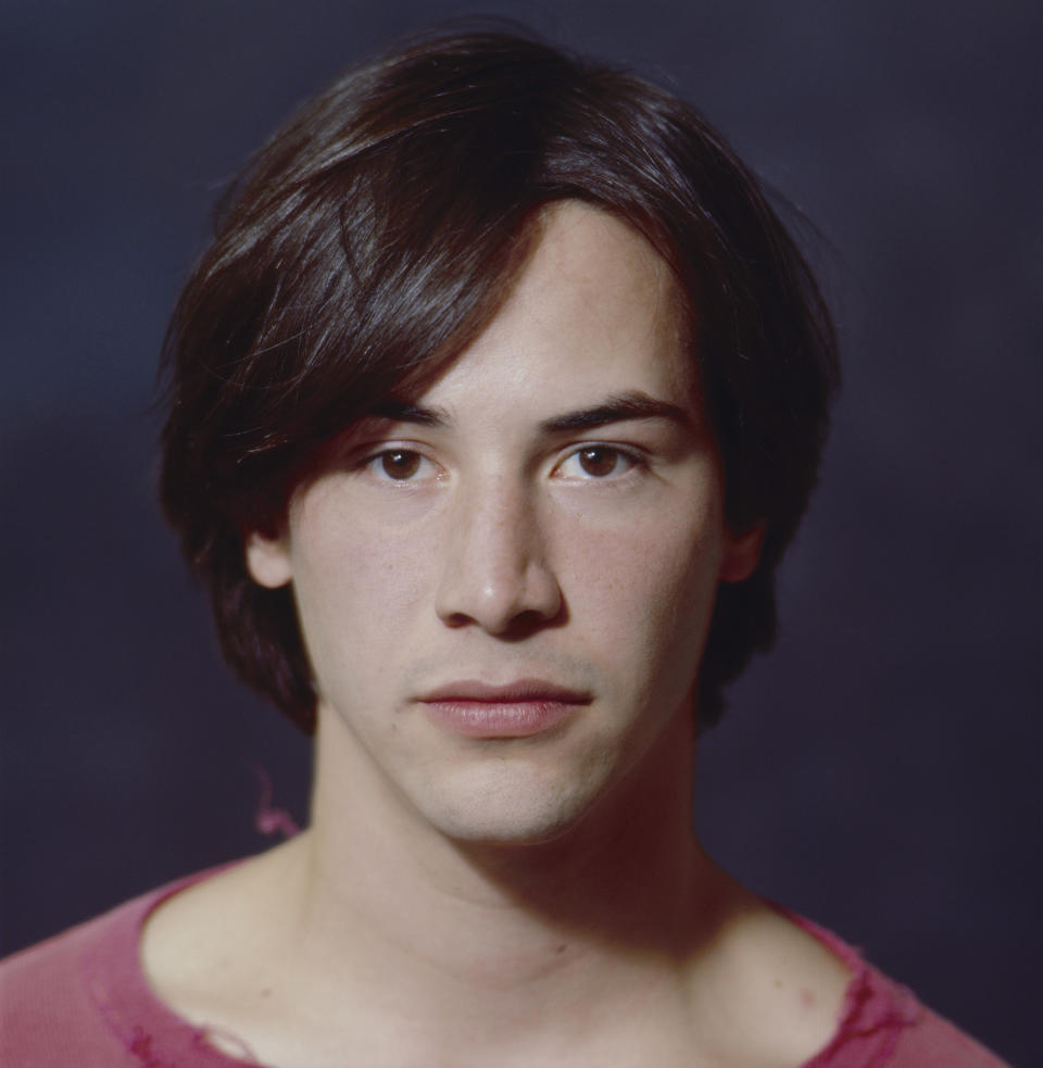 Keanu in a dark-pink-ish shirt