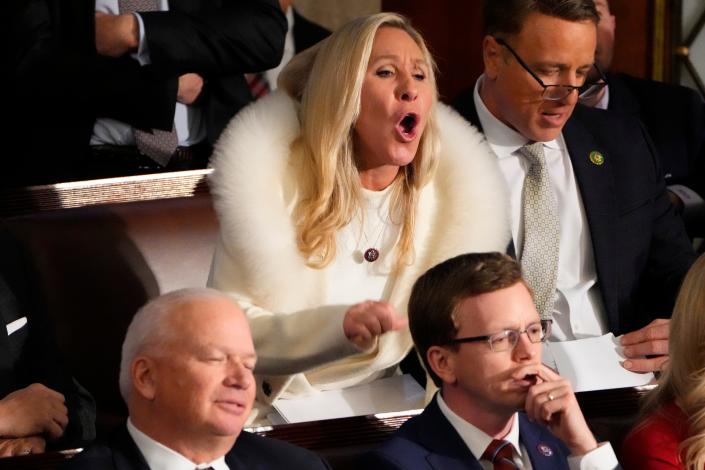 Rep. Marjorie Taylor Greene, R-Ga., yells during President Joe Biden's State of the Union address on Feb. 7, 2023.