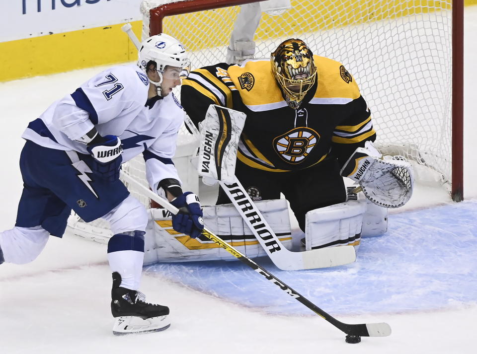 Boston Bruins goaltender Tuukka Rask (40) makes a save against Tampa Bay Lightning center Anthony Cirelli (71) during the second period of an NHL hockey playoff game Wednesday, Aug. 5, 2020 in Toronto. (Nathan Denette/The Canadian Press via AP)