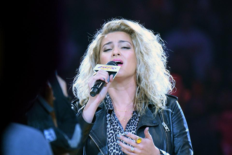 Tori Kelly sings the national anthem before an NBA basketball game between the Los Angeles Lakers and Denver Nuggets, Dec. 22, 2019, in Los Angeles.