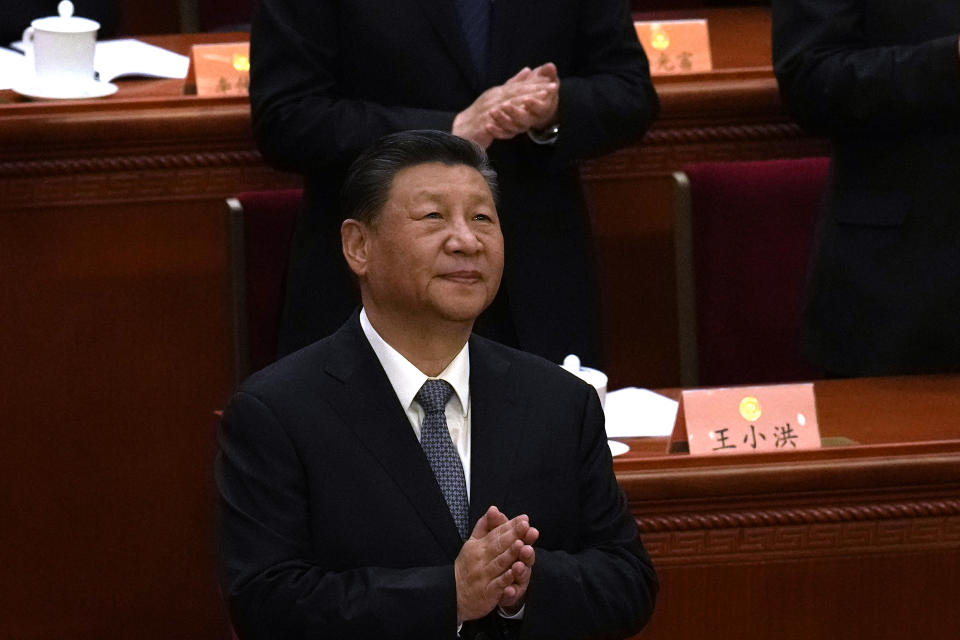 Chinese President Xi Jinping applauds during the opening session of the Chinese People's Political Consultative Conference in the Great Hall of the People in Beijing, Monday, March 4, 2024. (AP Photo/Ng Han Guan)