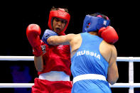 LONDON, ENGLAND - AUGUST 06: Sofya Ochigava of Russia (Blue) competes against Alexis Pritchard (Red) of New Zealand during the Women's Light (60kg) Boxing Quarterfinals on Day 10 of the London 2012 Olympic Games at ExCeL on August 6, 2012 in London, England. (Photo by Scott Heavey/Getty Images)