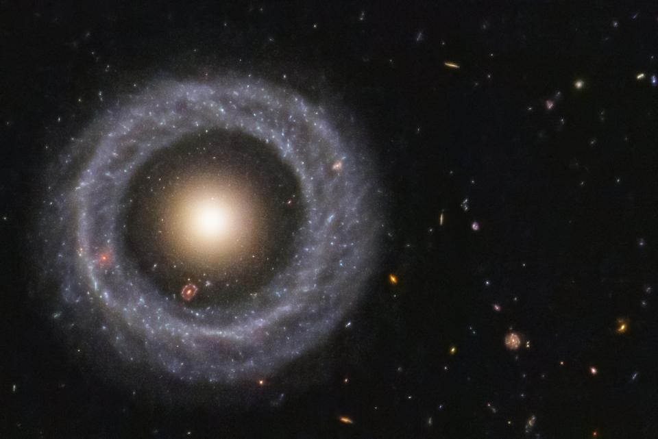 With a perfectly symmetrical ring circling a red sphere of stars, Hoag's object is one of the prettiest mysteries in the universe.