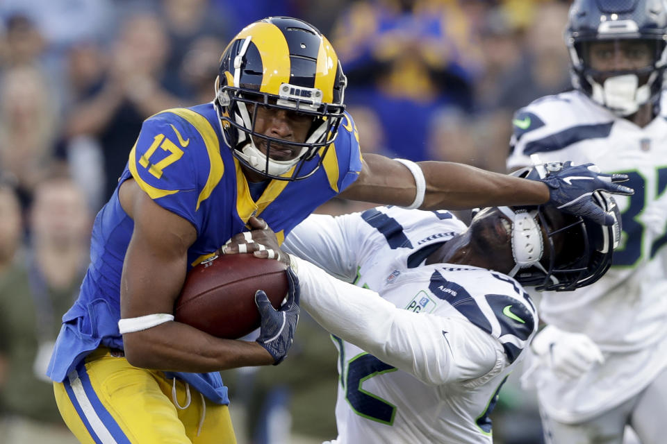 Los Angeles Rams wide receiver Robert Woods, left, pushes away Seattle Seahawks defensive back Delano Hill during the second half in an NFL football game Sunday, Nov. 11, 2018, in Los Angeles. (AP Photo/Alex Gallardo)