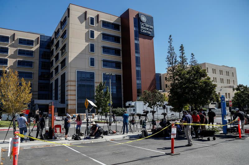 Members of media wait outside University of California Irvine Medical Center after it was announced that former U.S. President Bill Clinton was admitted to the hospital in Orange