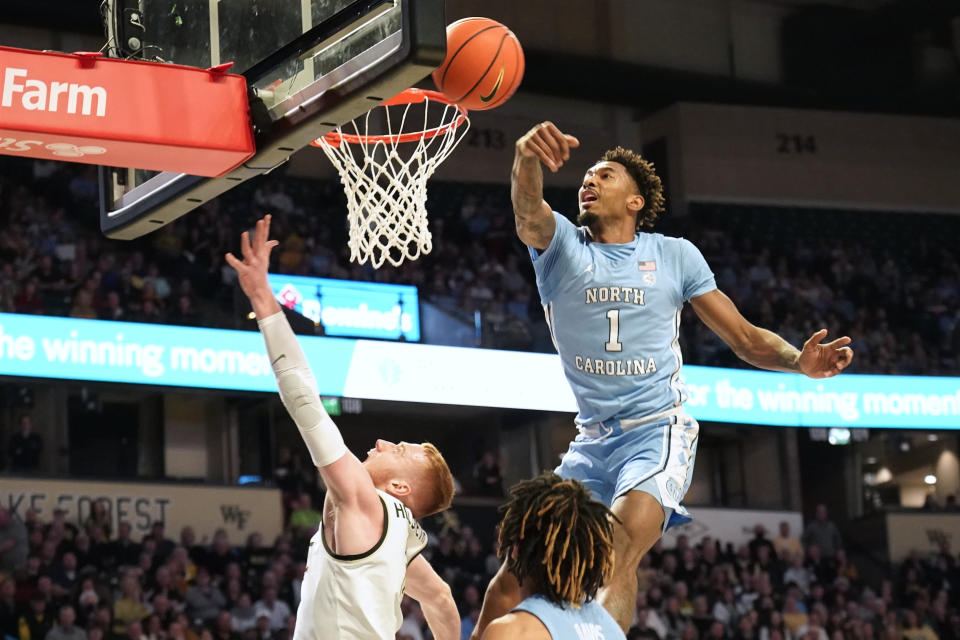 North Carolina forward Leaky Black (1) blocks a shot by Wake Forest guard Cameron Hildreth (2) during the first half of an NCAA college basketball game in Winston-Salem, N.C., Tuesday, Feb. 7, 2023. (AP Photo/Chuck Burton)