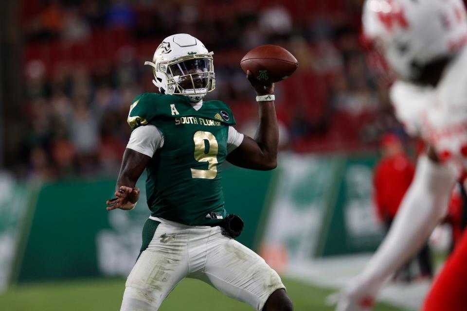 South Florida Bulls quarterback Timmy McClain throws against Houston during the second half of an NCAA college football game Saturday, Nov. 6, 2021, in Tampa.