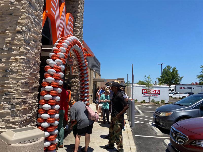 Customers wait in line to get Whataburger the day it opened in Southaven. The Whataburger Southaven location at 176 Goodman Road East opened it's doors at 11 a.m. Monday.