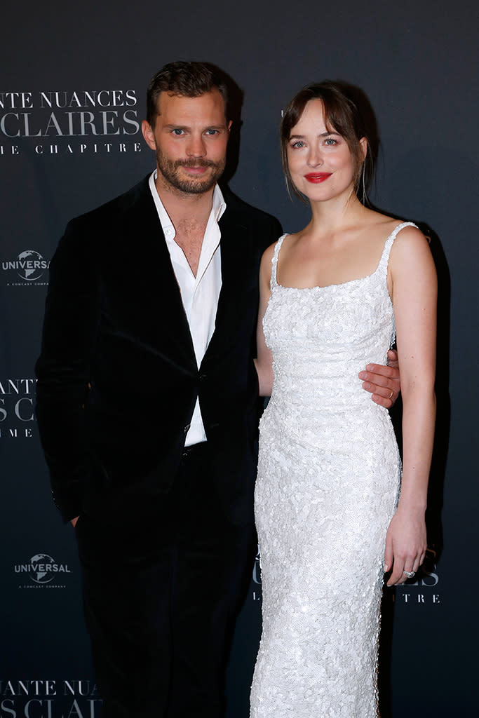 <p>Get your blindfolds ready! The co-stars posed on the red carpet Tuesday night at the Paris premiere of <em>Fifty Shades Freed — </em>the third and final installment of the sexy series. (Photo: Bertrand Rindoff Petroff/Getty Images) </p>