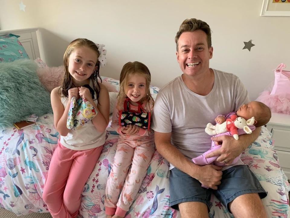 Grant Denyer and his three daughters