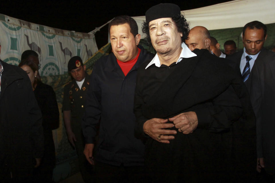 Hugo Chavez is pictured with Libya's former leader Muammar Gaddafi in Tripoli, Libya in 2010. Chavez had a number of controversial friends, from Gaddafi to Syrian President Bashar al-Assad, Iranian President Mahmoud Ahmadinejad and Cuban revolutionary Fidel Castro. Such allies led to a frosty relationship with the United States and the West (Reuters)