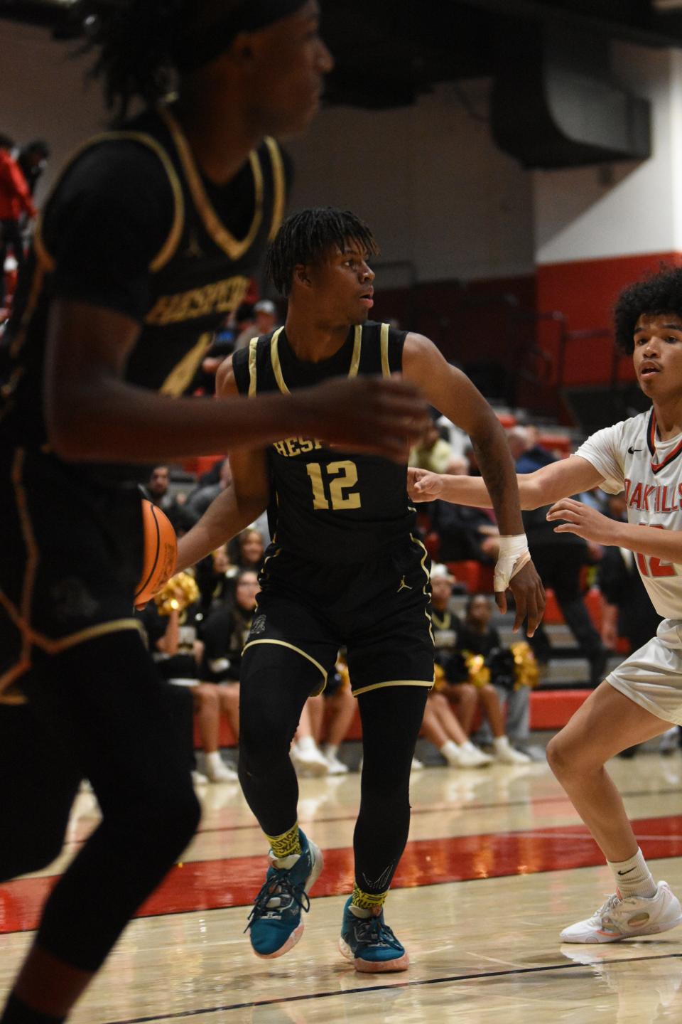 Hesperia’s Mark Jones looks for an opening during the third quarter against Oak Hills on Friday, Feb, 2, 2024. Hesperia defeated Oak Hills 64-60 to capture the Mojave River League title.