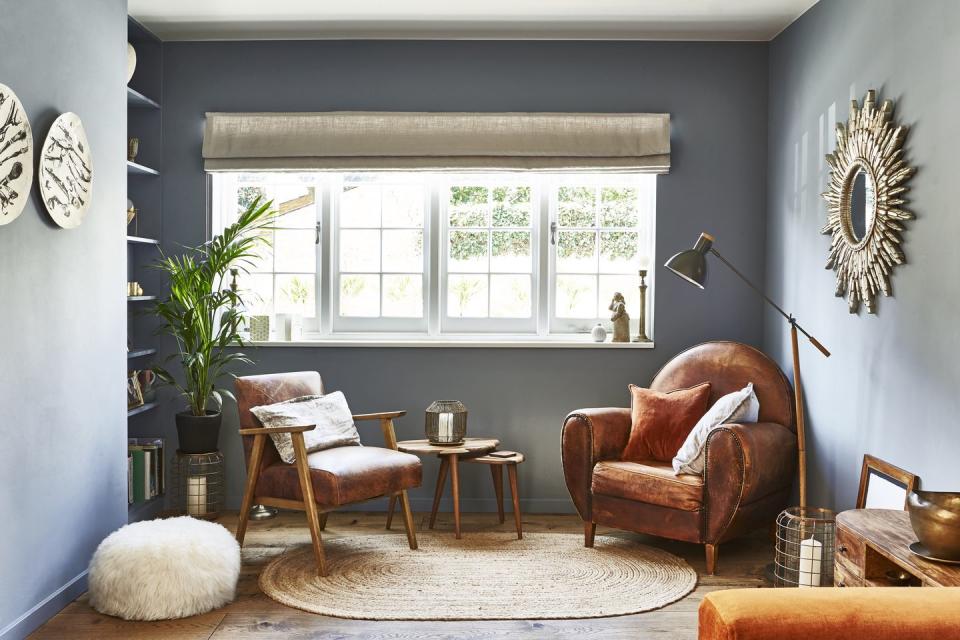 a reading nook with chairs and a table