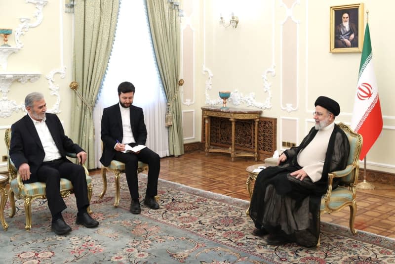 Iranian President Ebrahim Raisi (R) meets with leader of the Palestinian Islamic Jihad group Ziyad al-Nakhalah (L), in Tehran. -/Iranian Presidency/dpa