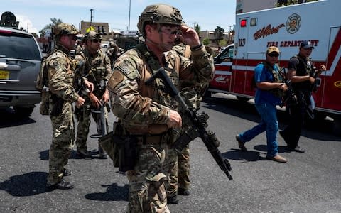 Law enforcement agencies respond to an active shooter at a Wal-Mart near Cielo Vista Mall in El Paso, Texas, Saturday, Aug. 3, 2019. - Credit: AFP