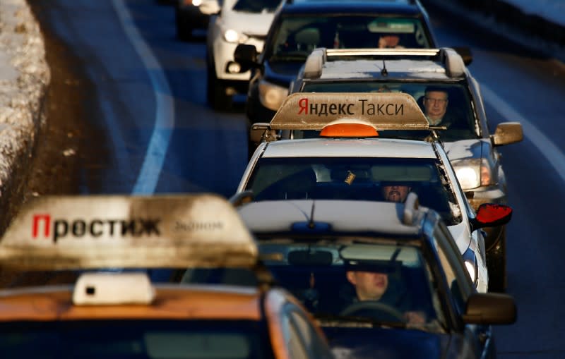 FILE PHOTO: A car with the logo of Russian online taxi service Yandex Taxi is seen stuck in a traffic jam in Moscow