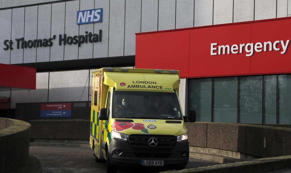 An ambulance drives of a hospital in London, Wednesday, Dec. 30, 2020. Reports say that pressure on the NHS is rising and it is absolutely critical that people follow the rules and do everything they can to stop the spread, especially of the new variant of this virus that transmits so much faster.UK Health Secretary Matt Hancock said on Wednesday the Oxford-AstraZeneca drug approval will accelerate Britain's coronavirus vaccination programme.(AP Photo/Frank Augstein)