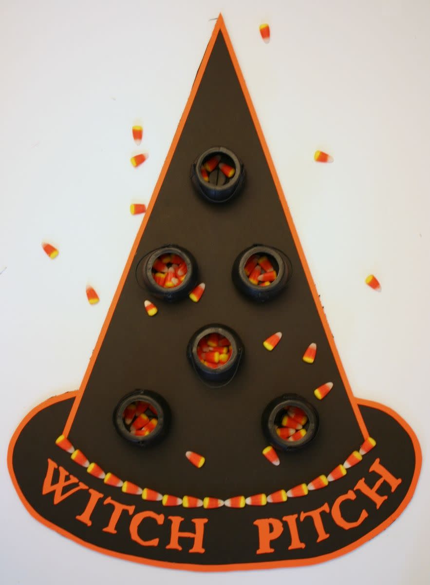 <p>Mini cauldrons turn that oversized bag of candy corn into a carnival game. Who will sink the most sweet treats? </p><p><em><a href="http://www.chicaandjo.com/2010/10/28/halloween-party-game/" rel="nofollow noopener" target="_blank" data-ylk="slk:Get the tutorial at Chica and Jo »;elm:context_link;itc:0;sec:content-canvas" class="link ">Get the tutorial at Chica and Jo »</a></em> </p>