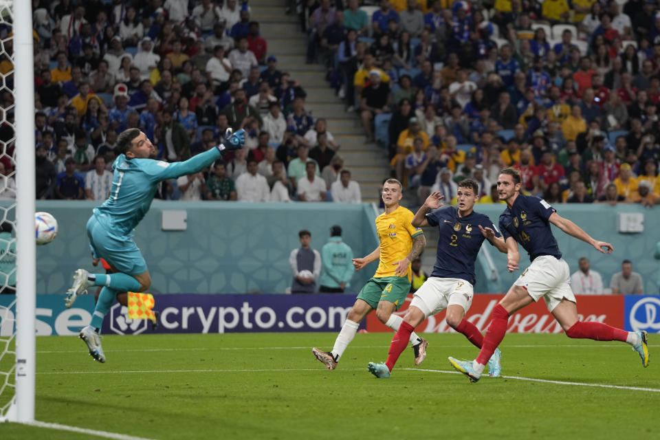 France's Adrien Rabiot, first right, scores with a header during the World Cup group D soccer match between France and Australia, at the Al Janoub Stadium in Al Wakrah, Qatar, Friday, Nov. 4, 2022. (AP Photo/Frank Augstein)