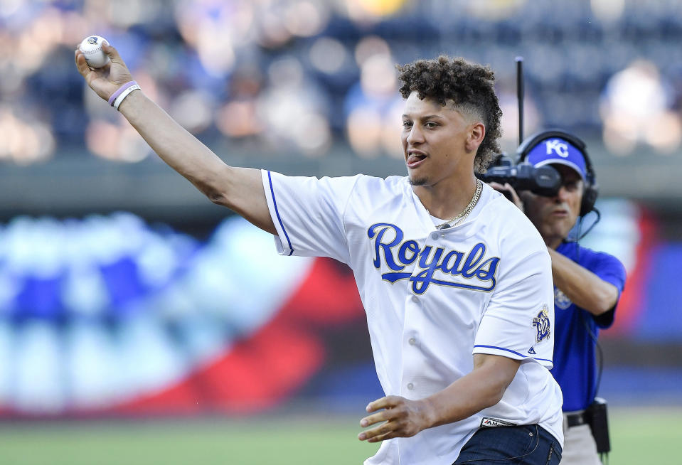 Patrick Mahomes shows off his arm throwing out the first pitch before a Royals game in 2018. Mahomes, the son of former Major League Baseball player Patrick Mahomes Sr., played baseball in high school. (John Sleezer/Kansas City Star/Tribune News Service via Getty Images)