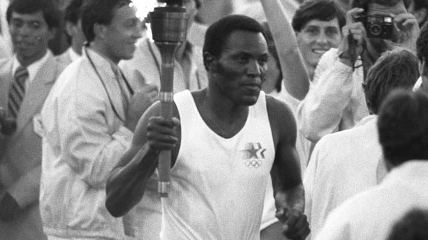 7/28/1984 – OLY LEGACY – Rafer Johnson runs around the track at the Los Angeles Coliseum.