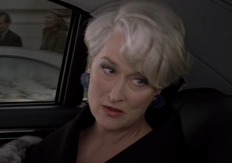 Meryl Streep as Miranda Priestley talks with Andy in the back of her car