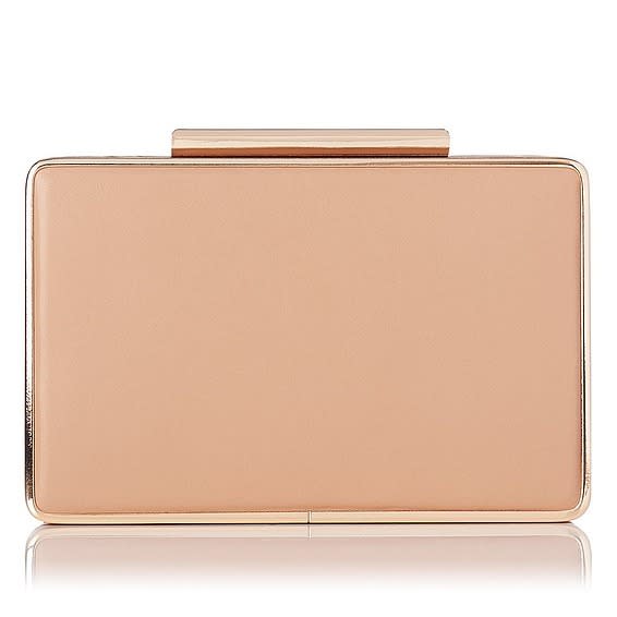 <p>The Duchess is rarely without this go-to clutch from her favourite shoe brand, L.K. Bennett. Small, neutral and compact, she brings it with her everywhere she goes – it’s already made two appearances on her <a href="https://ca.style.yahoo.com/royals-canada-kate-kids-touch-151040546.html" data-ylk="slk:Canadian tour;elm:context_link;itc:0;sec:content-canvas;outcm:mb_qualified_link;_E:mb_qualified_link;ct:story;" class="link  yahoo-link">Canadian tour</a>! <i>(Approx. $314 <a href="http://www.lkbennett.com/Collections/Clothing/Nina-Clutch-In-Trench/p/BCNINATRENCHBeigeTrench?utm_campaign=cj_affiliate_sale&utm_medium=affiliate&utm_source=cj&utm_content=4441350&utm_term=11824724" rel="nofollow noopener" target="_blank" data-ylk="slk:at L.K. Bennett;elm:context_link;itc:0;sec:content-canvas" class="link ">at L.K. Bennett</a>)</i></p>