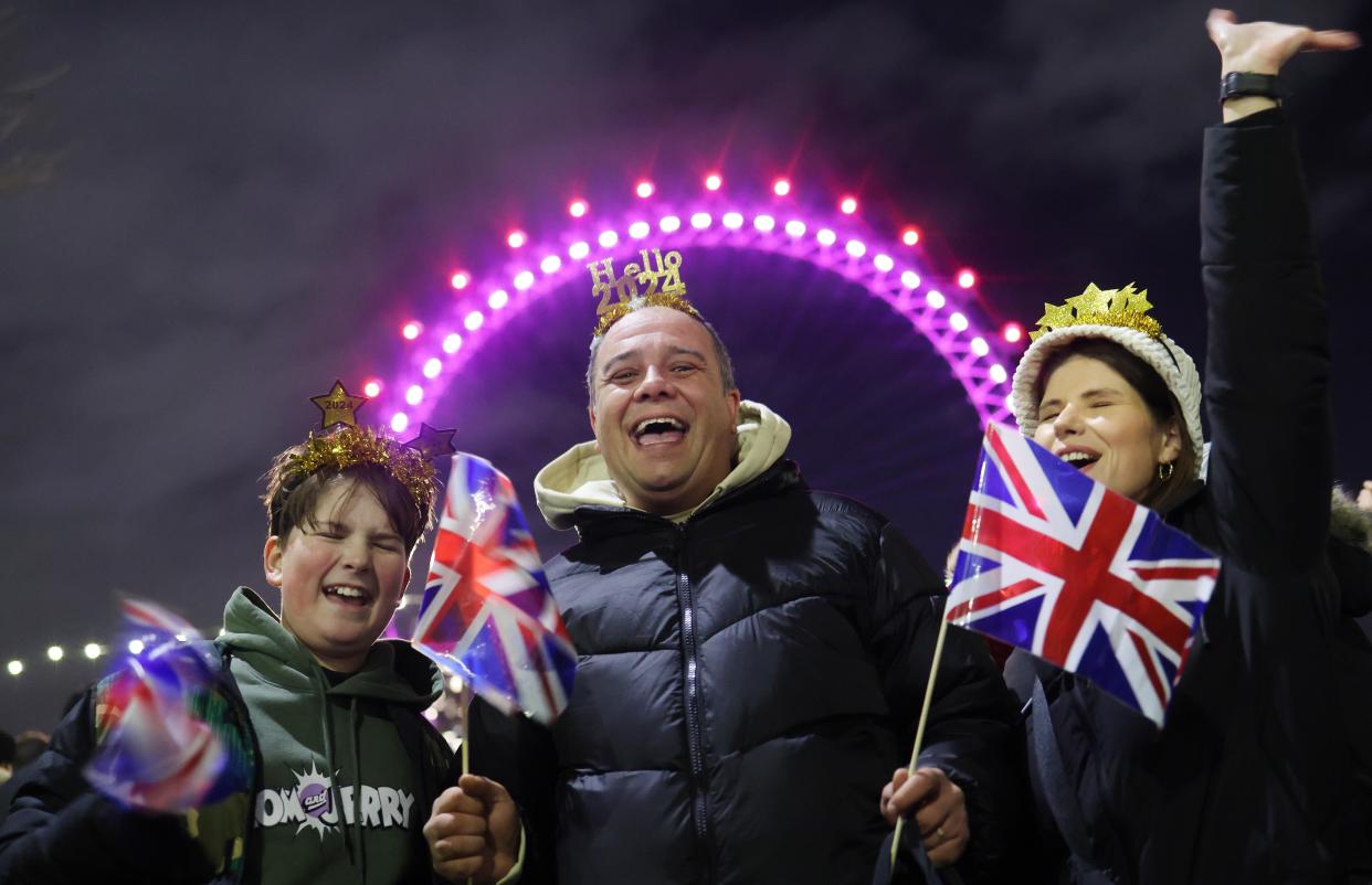 The flags are waving as a family get ready to party (EPA)
