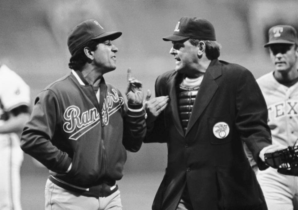 FILE - Texas Rangers manager Bobby Valentine, left, argues with home plate umpire Don Denkinger during the third inning of the team's baseball game against the Cleveland Indians on May 13, 1986, in Cleveland. The umpires ordered Ranger Tom Paciorek back to third in the dispute and Valentine protested the game. Denkinger, a major league umpire for three decades whose blown call in the 1985 World Series overshadowed a three-decade career of excellence, died Friday, May 12, 2023. He was 86. (AP Photo/Mark Duncan, File)