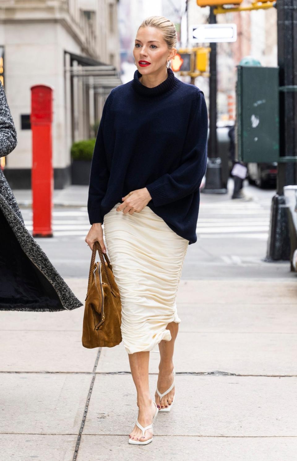 Sienna Miller was spotted wearing heeled flip-flops in New York City