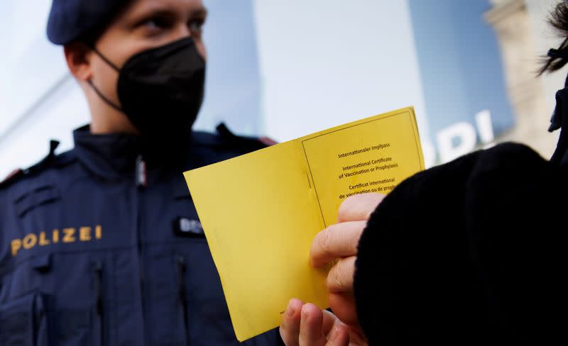 FILE PHOTO: Police patrol streets to check people's vaccination status