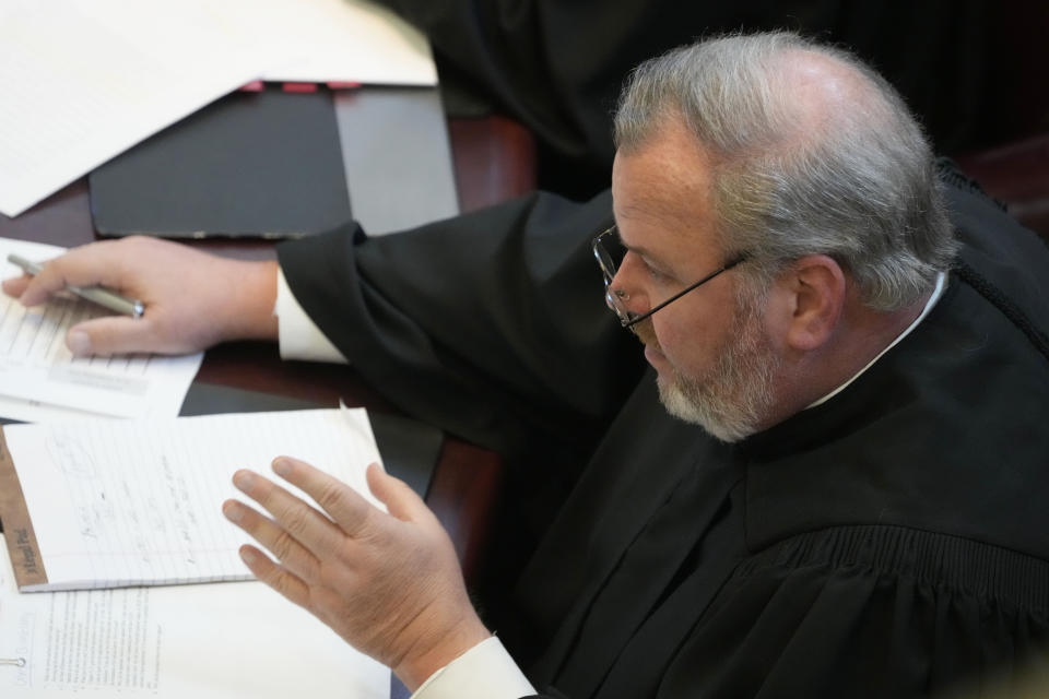 Mississippi Supreme Court Associate Justice David M. Ishee asks a question of lawyers during their arguments on the constitutionality of a Mississippi law that would authorize some judges who would be appointed in a state where most judges are elected, Thursday, July 6, 2023, before the state supreme court in Jackson, Miss. (AP Photo/Rogelio V. Solis)